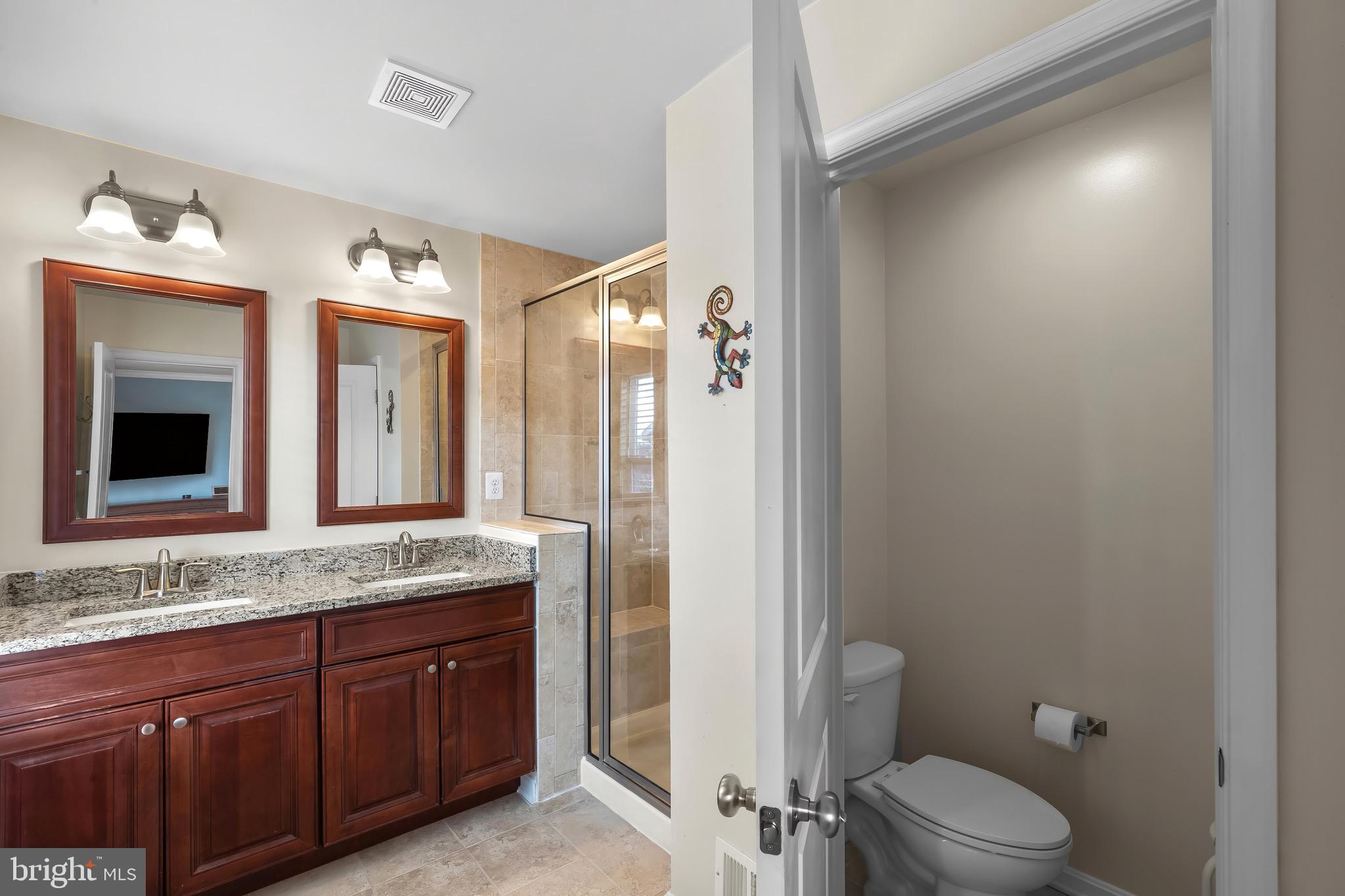 2065 Case Road Baltimore, MD 21222 - Photo 18 of 48 a bathroom with a granite countertop sink mirror vanity and toilet