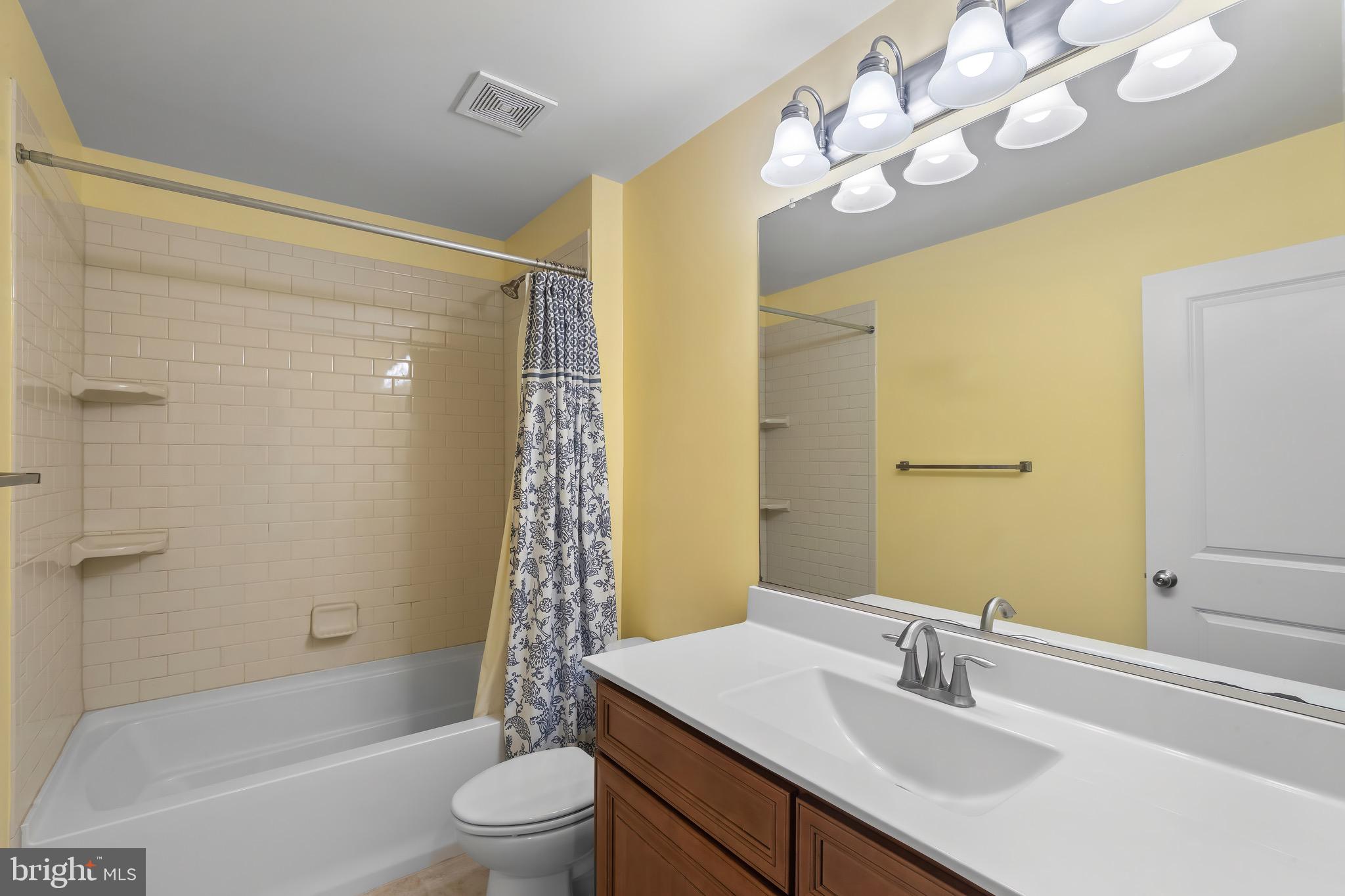 2065 Case Road Baltimore, MD 21222 - Photo 22 of 48 a bathroom with a sink a toilet a mirror and shower