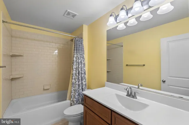 a view of a patio with table and chairs with wooden floor and fence