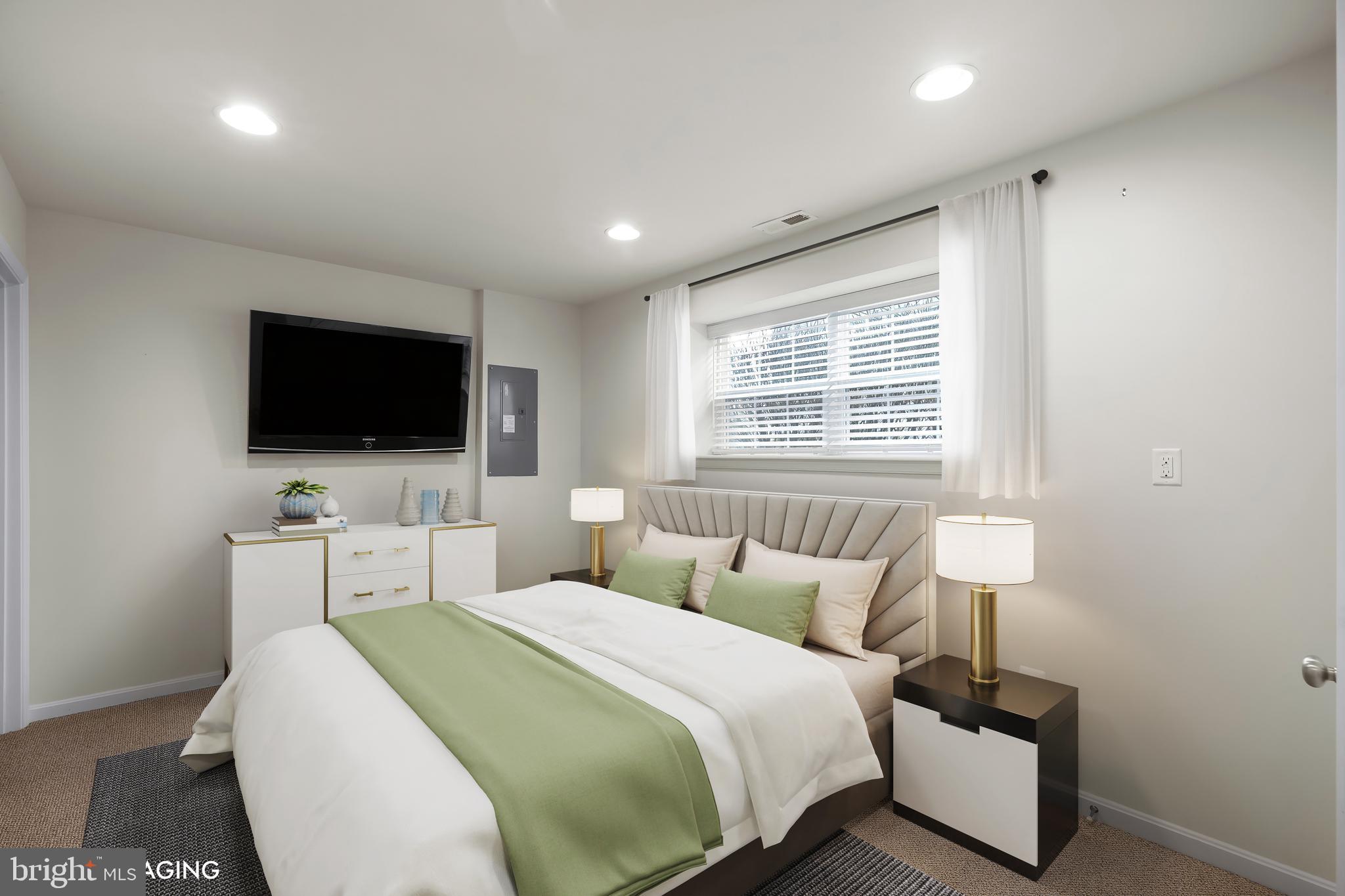 2065 Case Road Baltimore, MD 21222 - Photo 30 of 48 a bedroom with a bed and a flat screen tv