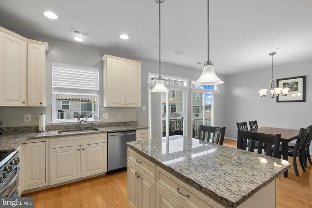 a kitchen with a table and chairs