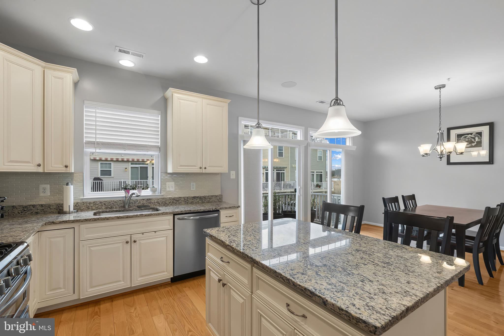 2065 Case Road Baltimore, MD 21222 - Photo 9 of 48 a kitchen with granite countertop a sink a center island a counter space and cabinets
