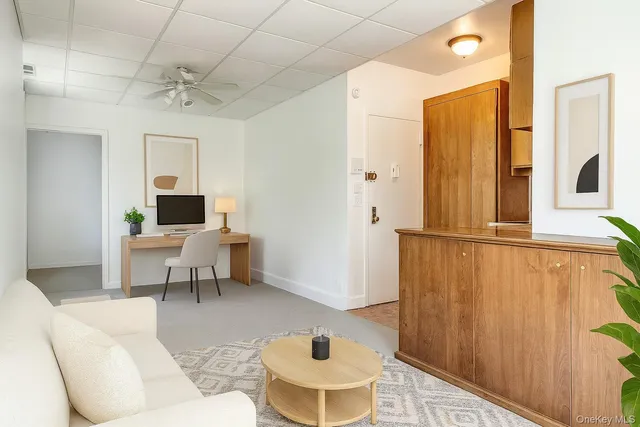 a living room with furniture and a table