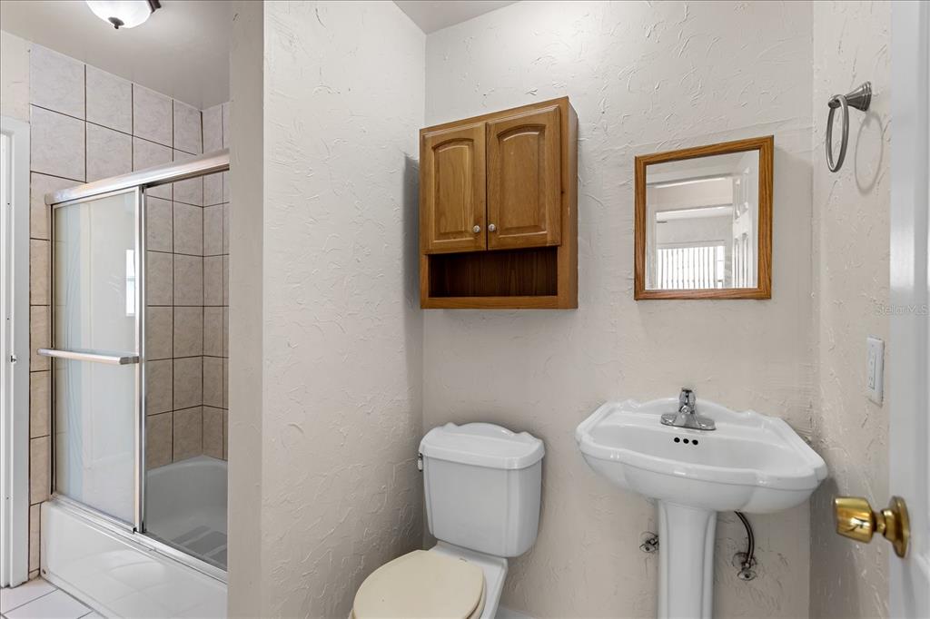 2786 Curry Ford Road, Unit 6B Orlando, FL 32806 - Photo 14 of 27 a bathroom with a toilet sink and shower