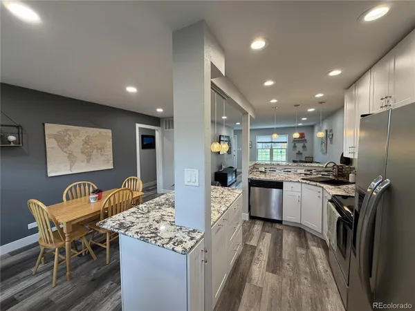 a kitchen with a table and chairs