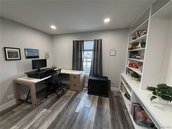 a workspace with furniture and wooden floor