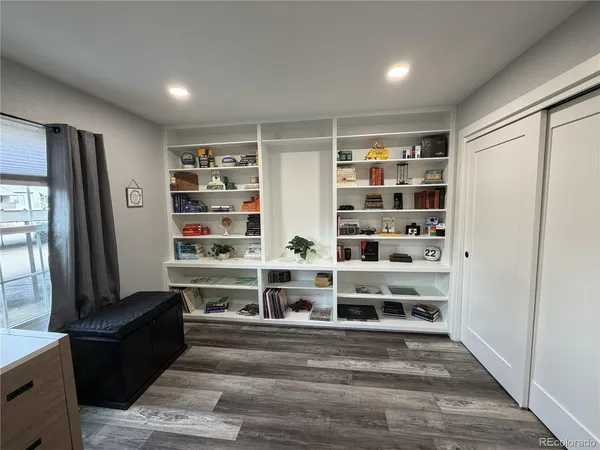 a view of walk in closet with empty racks