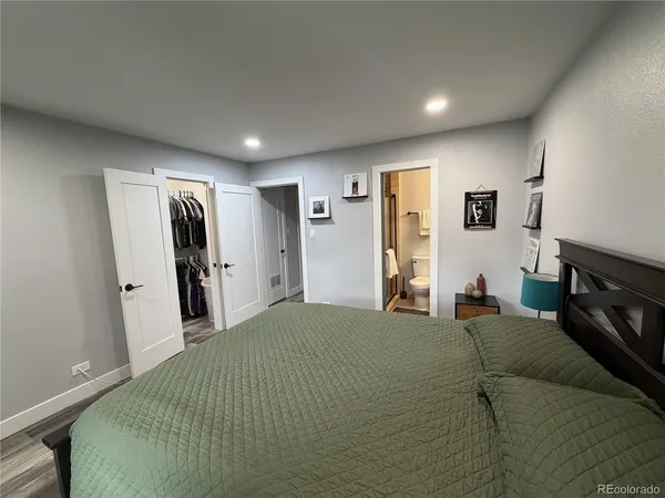 a bedroom with a bed and a television
