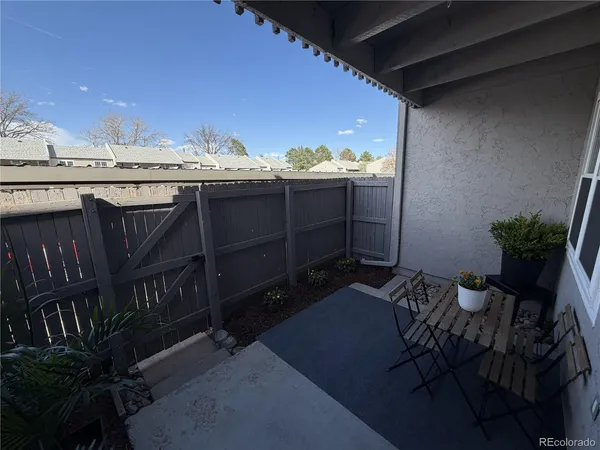 a view of a terrace with furniture and a potted plant