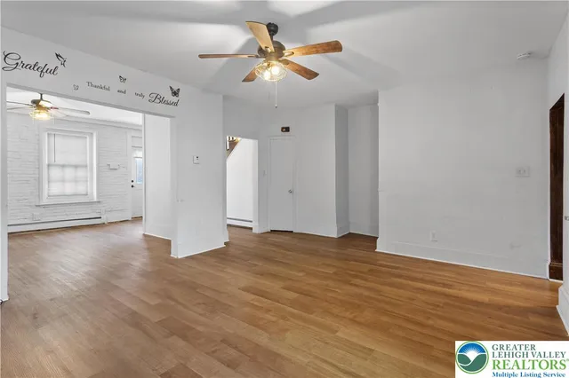 a kitchen with kitchen island granite countertop a sink a counter space stainless steel appliances and cabinets