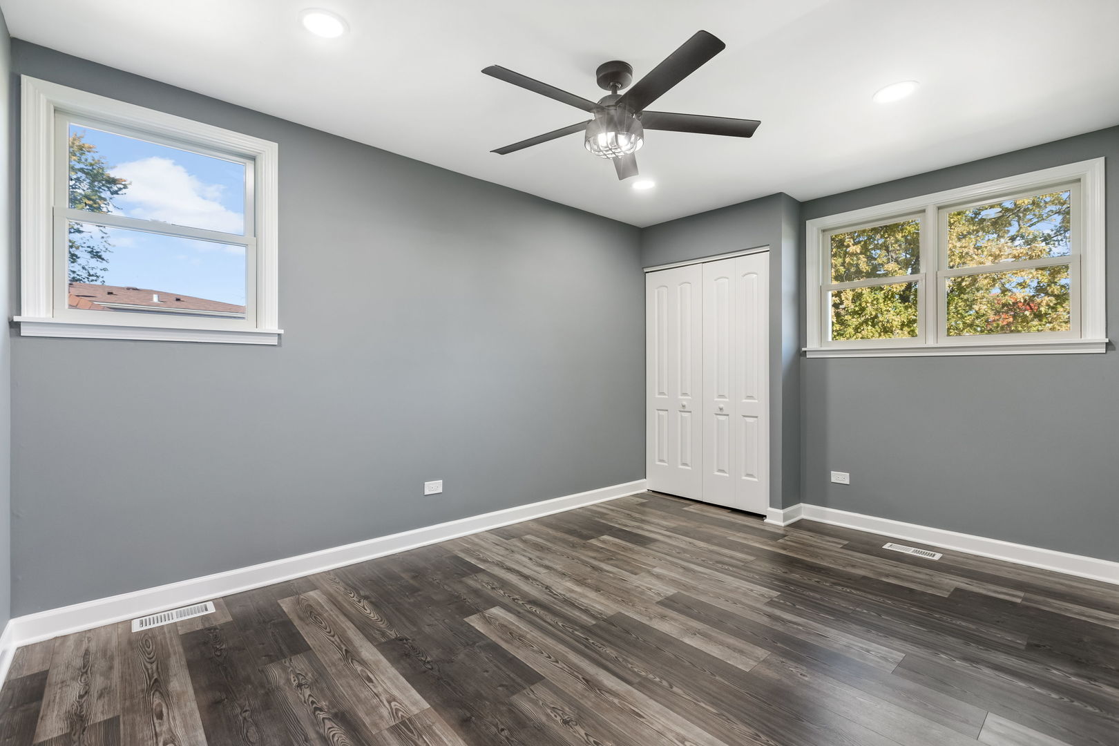 585 Cambridge Way Bolingbrook, IL 60440 - Photo 13 of 20 a view of a big room with wooden floor and windows