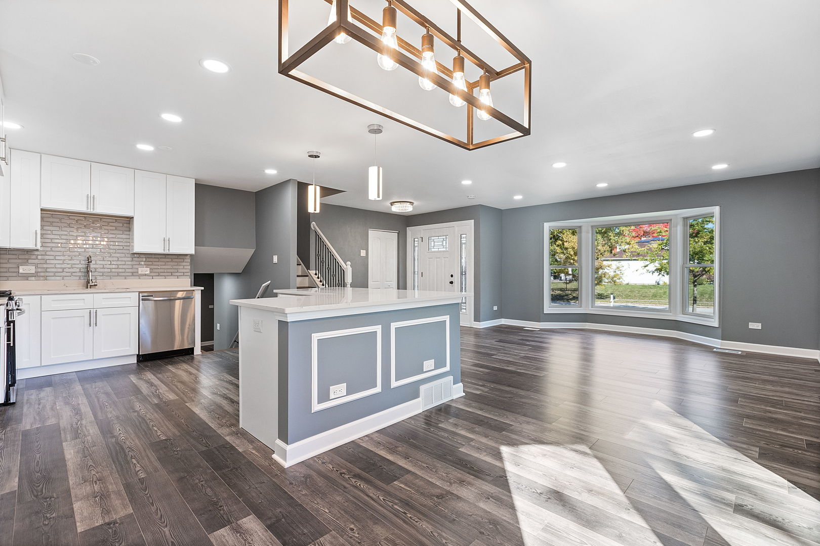585 Cambridge Way Bolingbrook, IL 60440 - Photo 4 of 20 a kitchen with stainless steel appliances granite countertop a stove and a sink