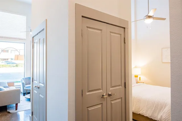 a view of a bedroom from a hallway