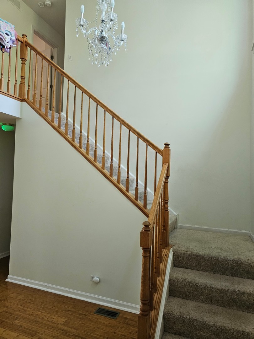 847 Teasel Lane Aurora, IL 60504 - Photo 11 of 19 a view of entryway with wooden floor
