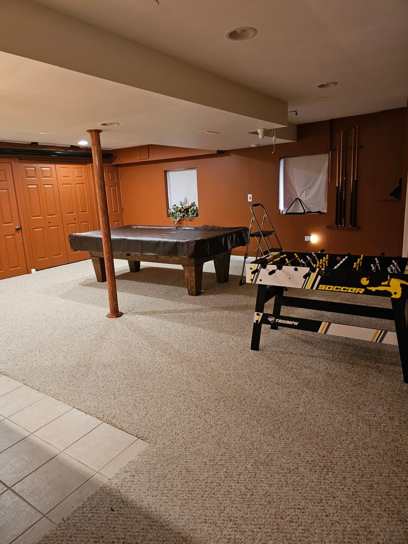 847 Teasel Lane Aurora, IL 60504 - Photo 15 of 19 a reading room with furniture and air hockey table