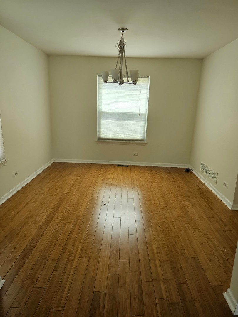 847 Teasel Lane Aurora, IL 60504 - Photo 4 of 19 a view of a room with wooden floor and a sink