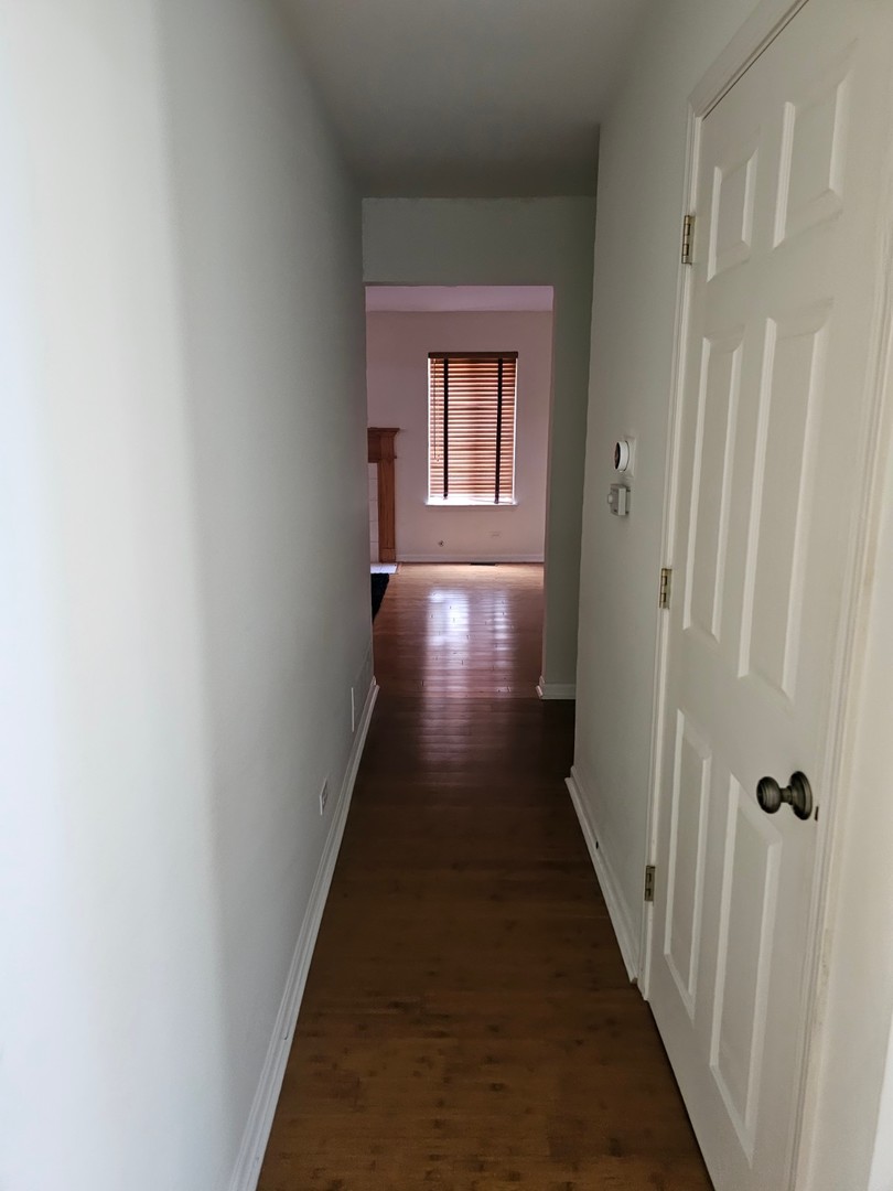 847 Teasel Lane Aurora, IL 60504 - Photo 9 of 19 a view of a hallway with wooden floor