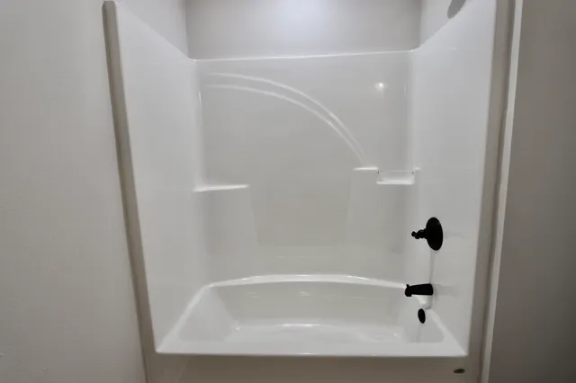 a close view of a bathtub in bathroom