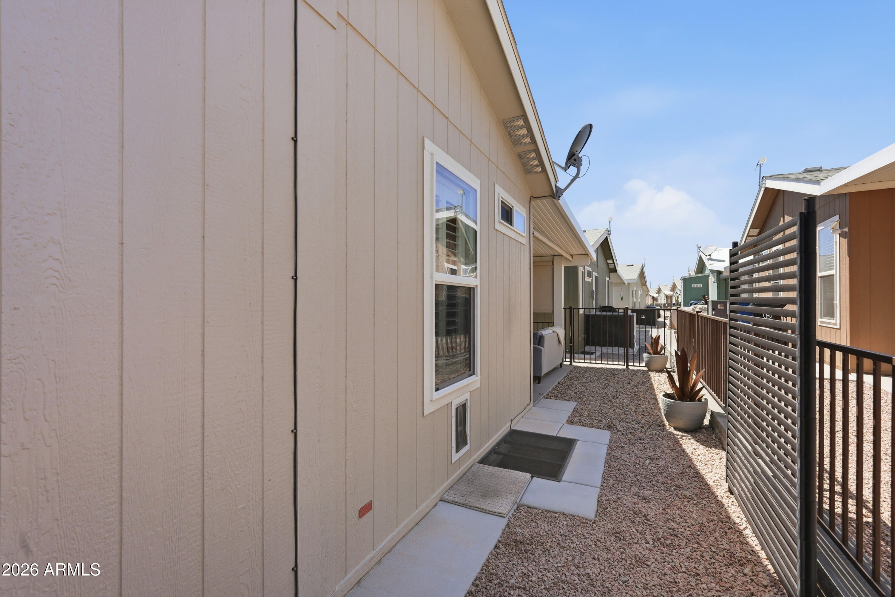 650 North Hawes Road, Unit 3318 Mesa, AZ 85207 - Photo 32 of 56 Fenced yard with doggy door