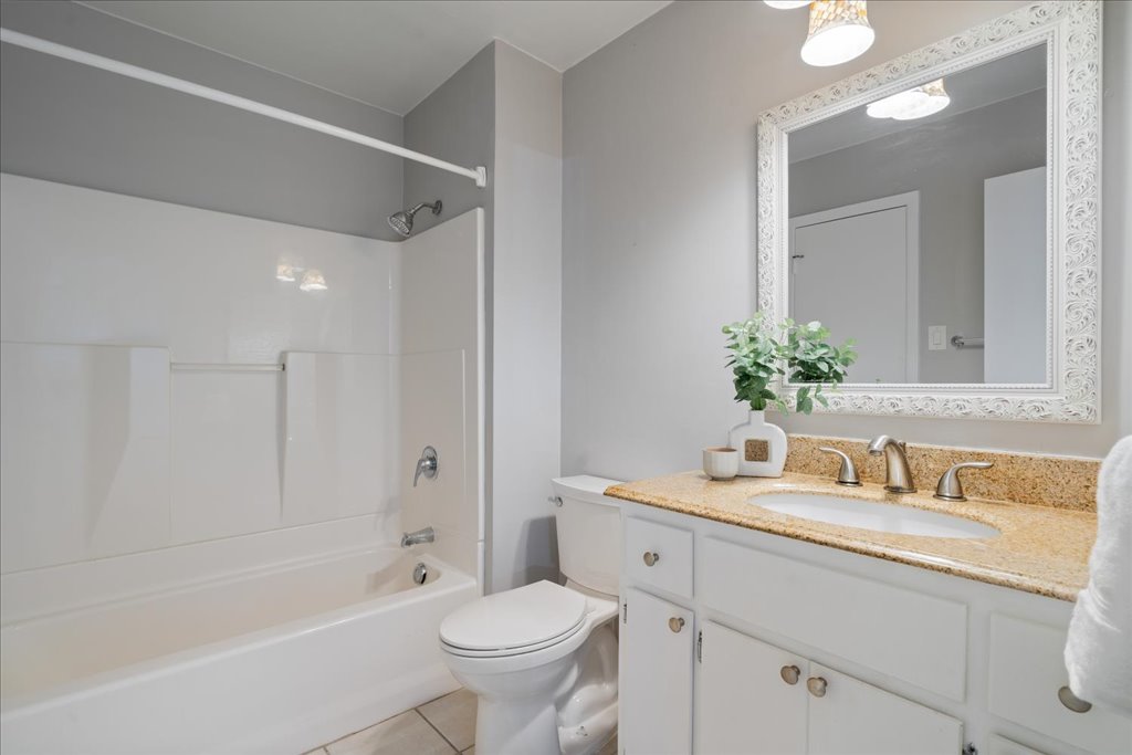 1748 Ohlen Road, Unit 76 Austin, TX 78757 - Photo 23 of 34 a bathroom with a sink toilet a bathtub and a vanity