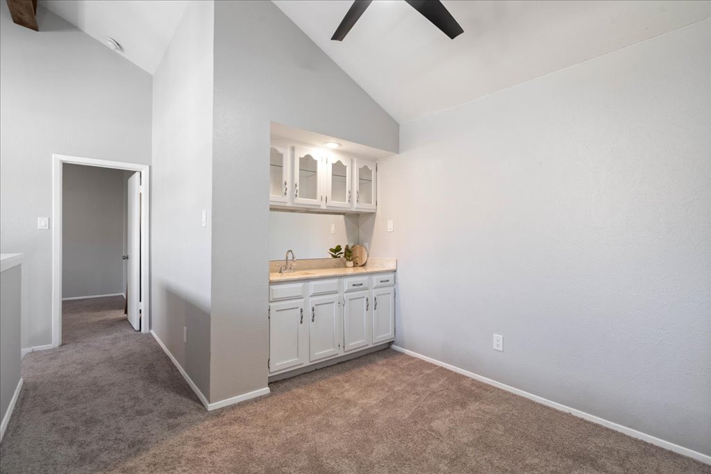 1748 Ohlen Road, Unit 76 Austin, TX 78757 - Photo 26 of 34 a room with white cabinets and sink