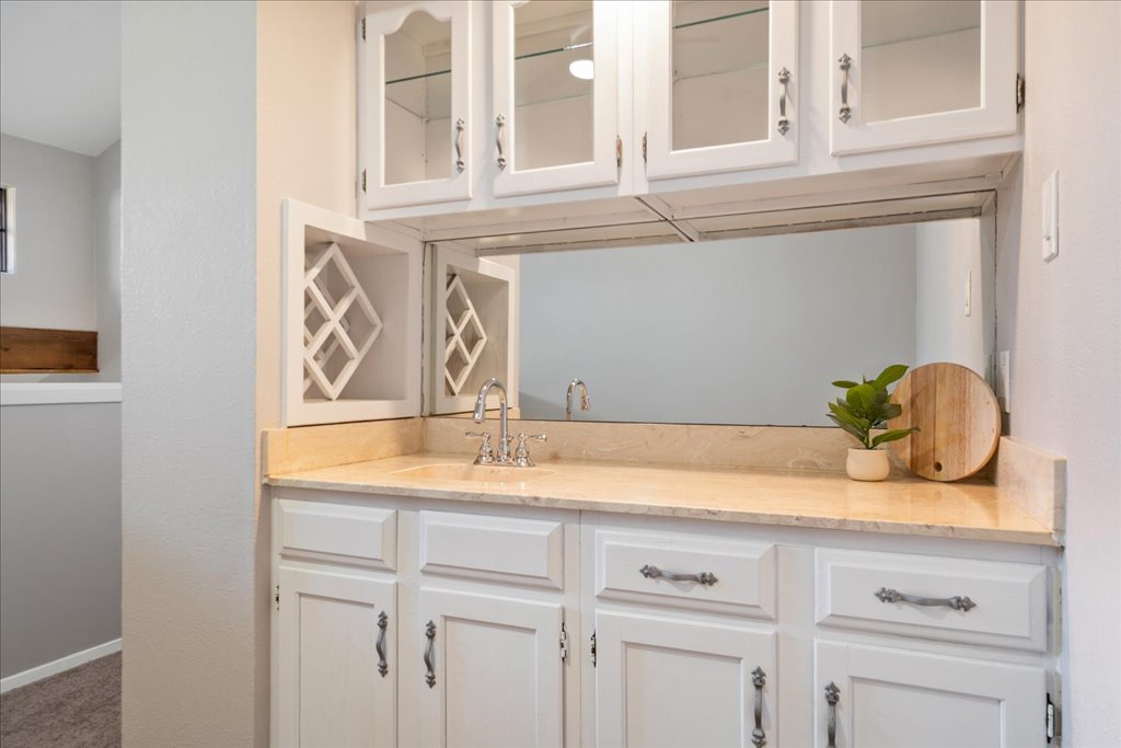 1748 Ohlen Road, Unit 76 Austin, TX 78757 - Photo 27 of 34 a bathroom with a sink and a mirror