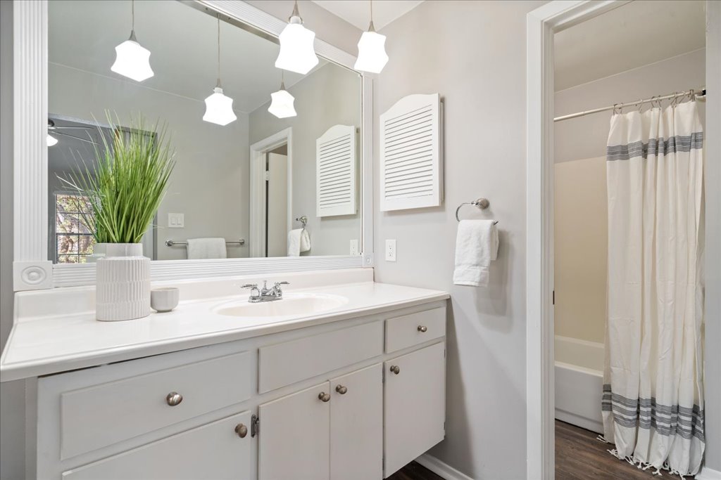 1748 Ohlen Road, Unit 76 Austin, TX 78757 - Photo 30 of 34 a bathroom with a sink and a mirror