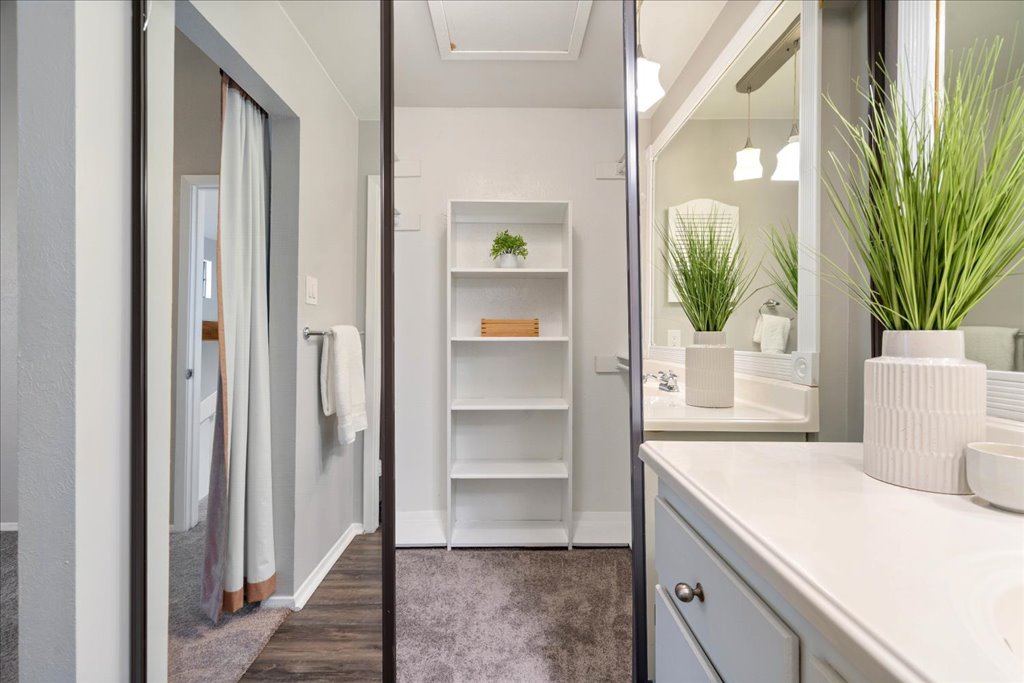 1748 Ohlen Road, Unit 76 Austin, TX 78757 - Photo 32 of 34 a room that has a bed in it and a mirror