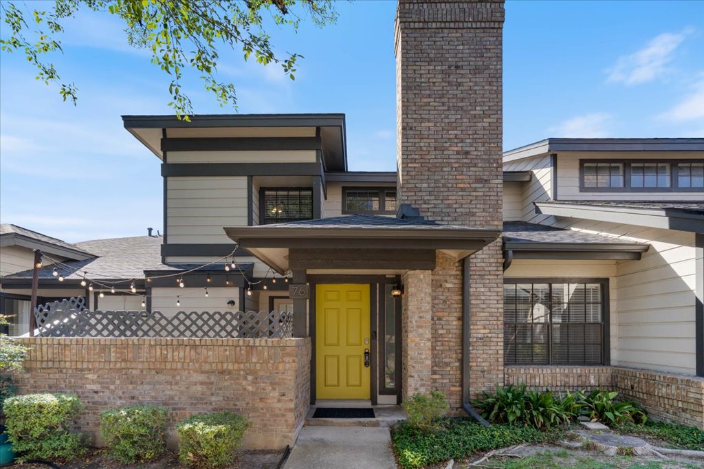 1748 Ohlen Road, Unit 76 Austin, TX 78757 - Photo 5 of 34 a front view of a house with garden