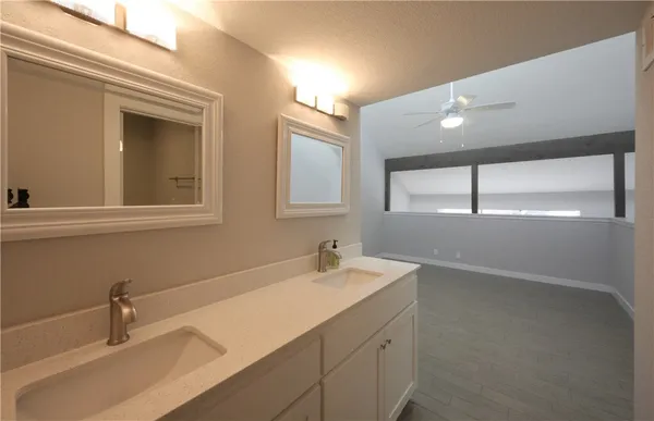 a bathroom with a sink and a window