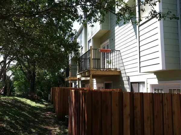 a view of a house with a fence