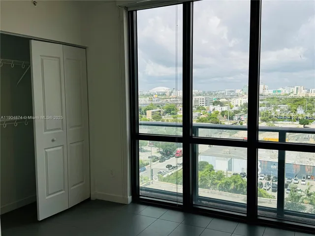 a view of a room with sliding glass door and mountain view