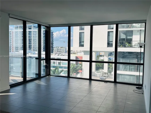 a view of a city from a corridor