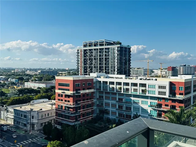 a view of city with tall buildings
