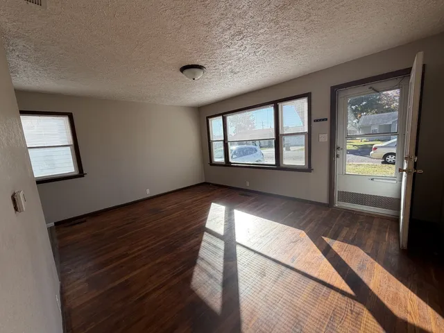 a view of an empty room and window