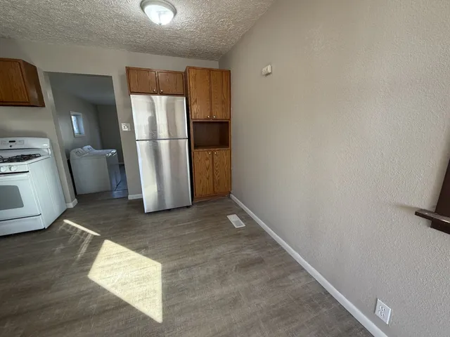 a view of a storage & utility room with a sink