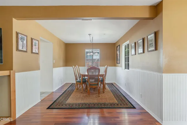 a living room with furniture rug and a table