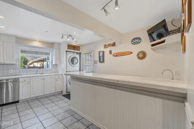 a spacious bathroom with a sink a mirror and a window