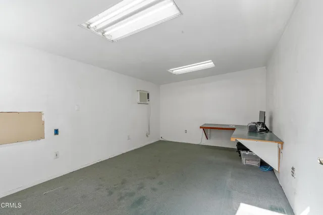 a view of workspace and bathroom