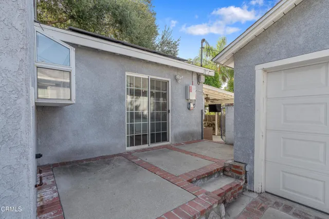 a backyard of a house with seating space