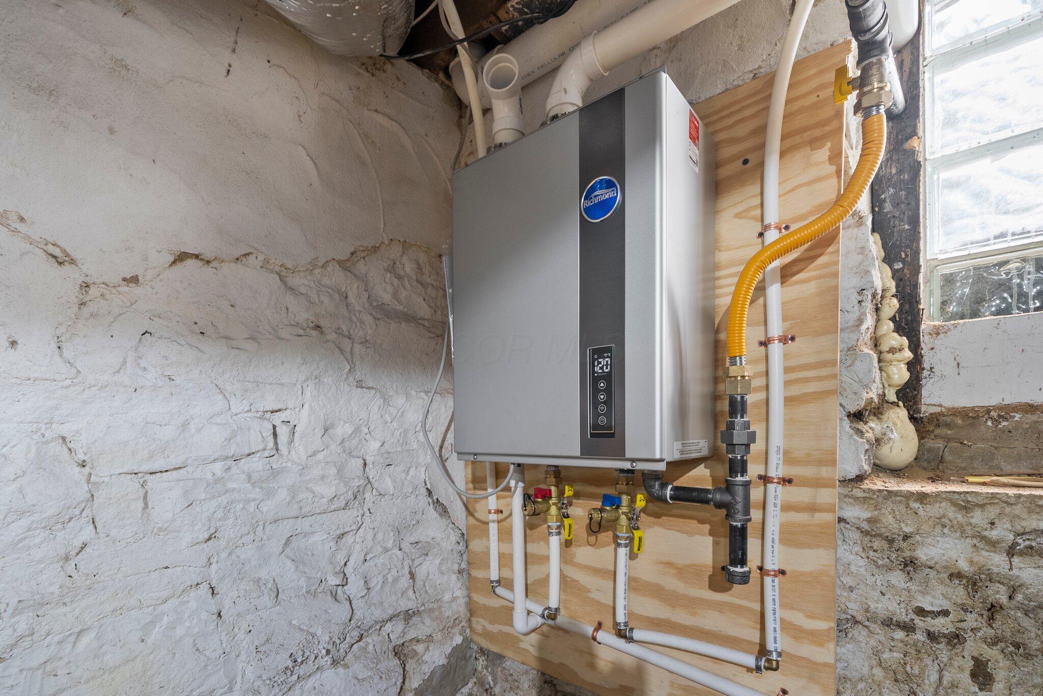 9214 Ashley Road Ashley, OH 43003 - Photo 45 of 77 Tankless water heater