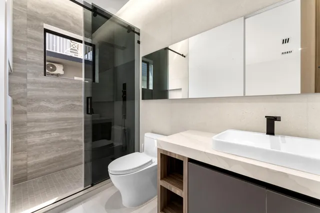 a balcony with view of palm tree