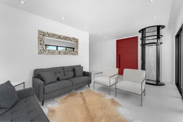 a living room with furniture and a large window