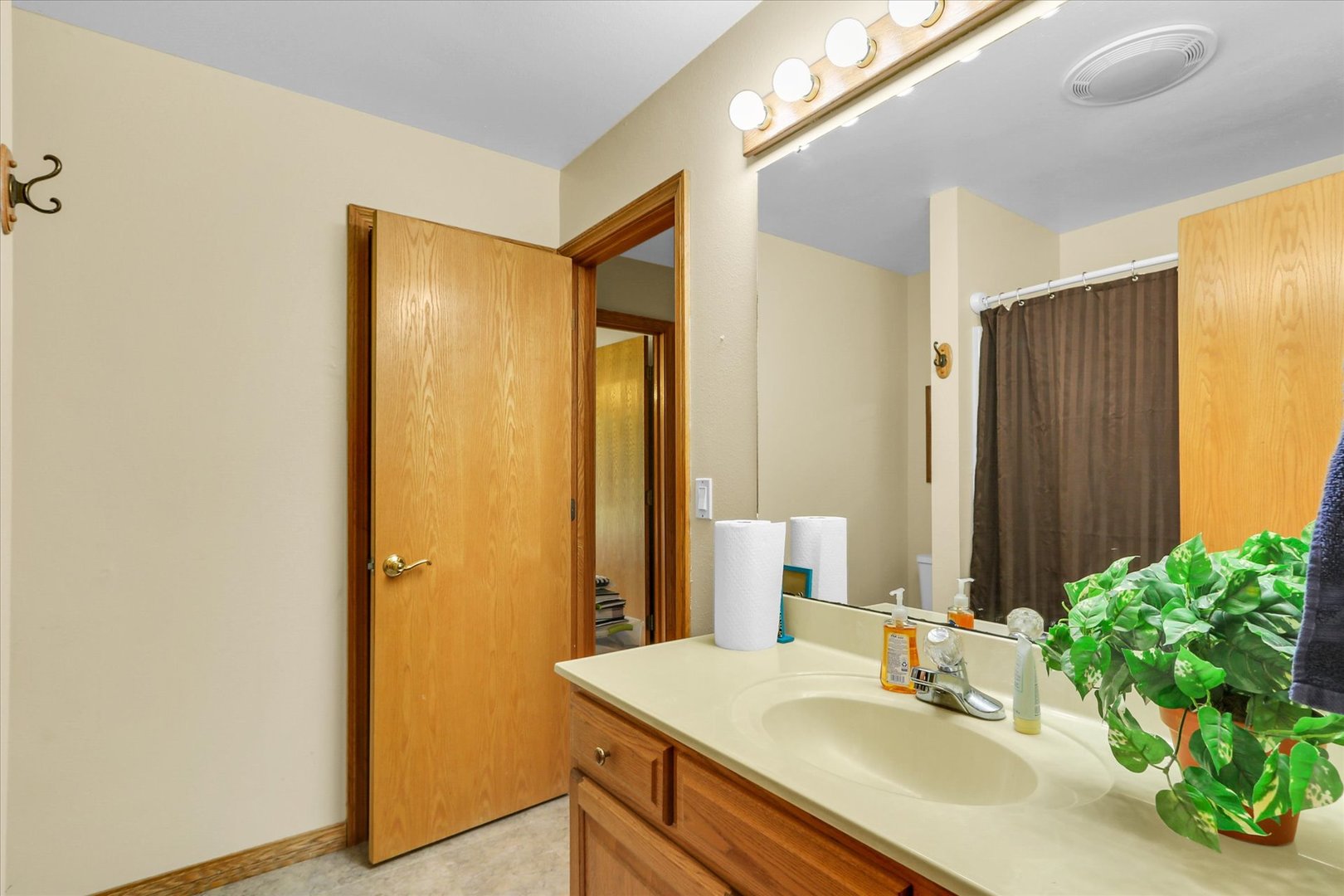 3110 Ridge Park Road Urbana, IL 61802 - Photo 20 of 26 a bathroom with a sink and a mirror