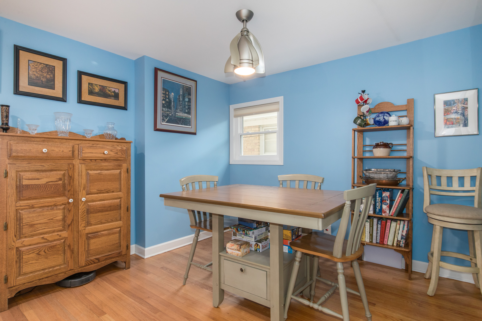 7417 North Oleander Avenue Chicago, IL 60631 - Photo 11 of 28 a view of a dining room with furniture and wooden floor