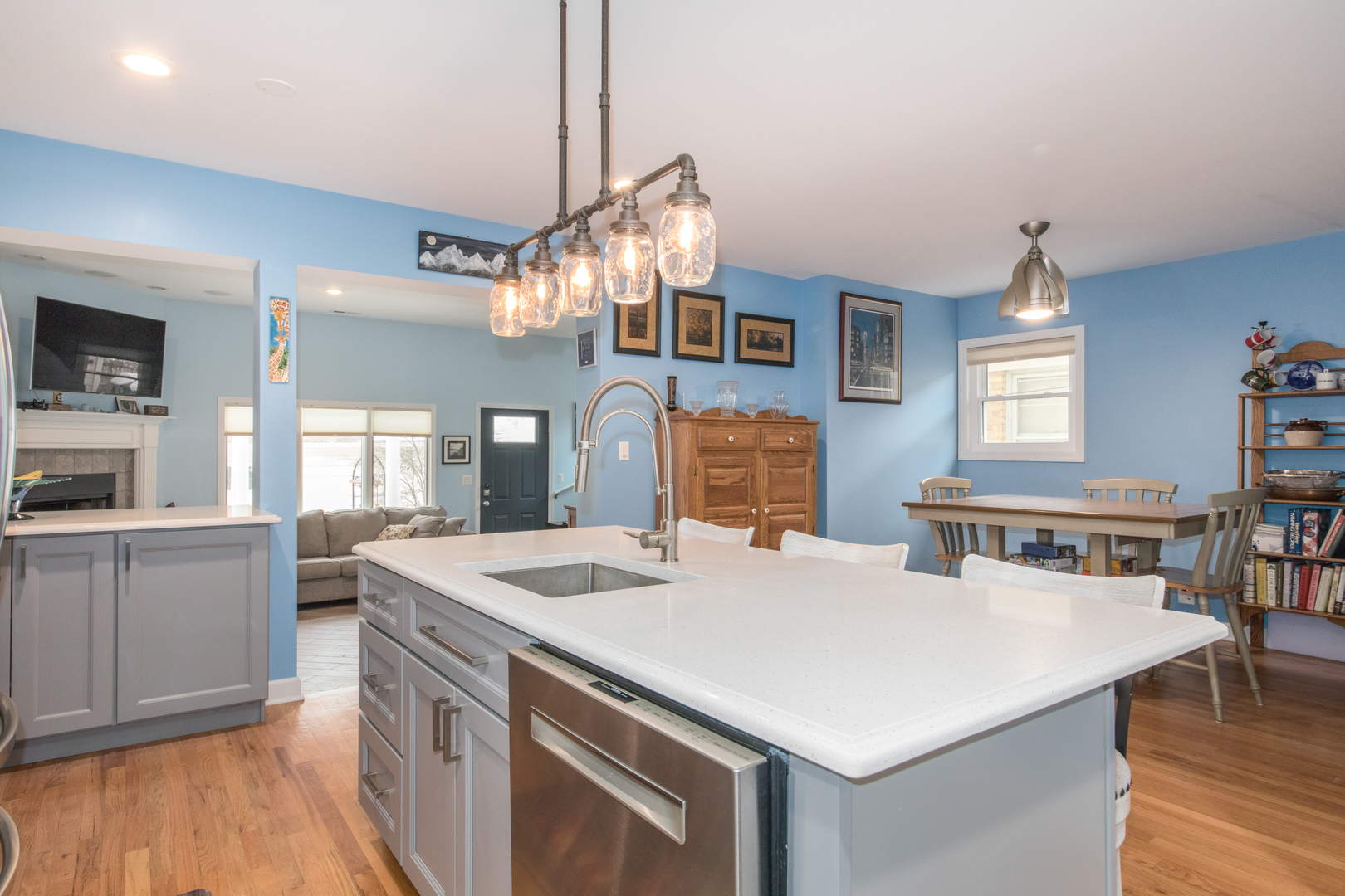 7417 North Oleander Avenue Chicago, IL 60631 - Photo 10 of 28 a kitchen that has a stove a table and chairs in it