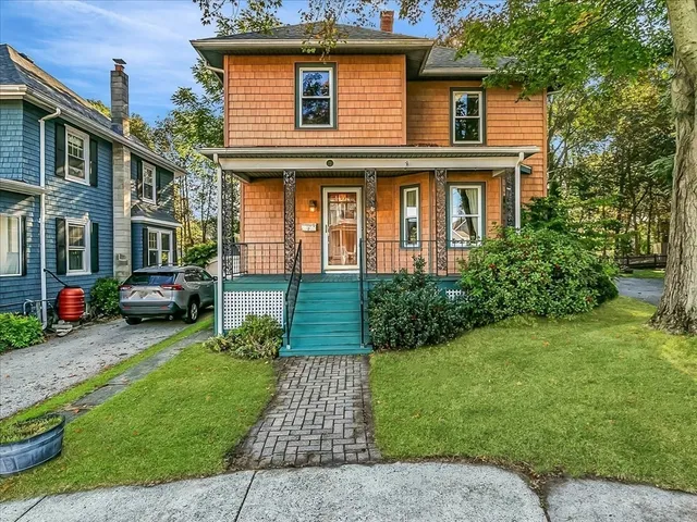 a front view of a house with garden