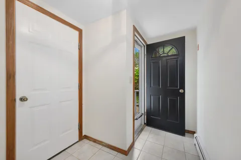a view of a hallway with front door