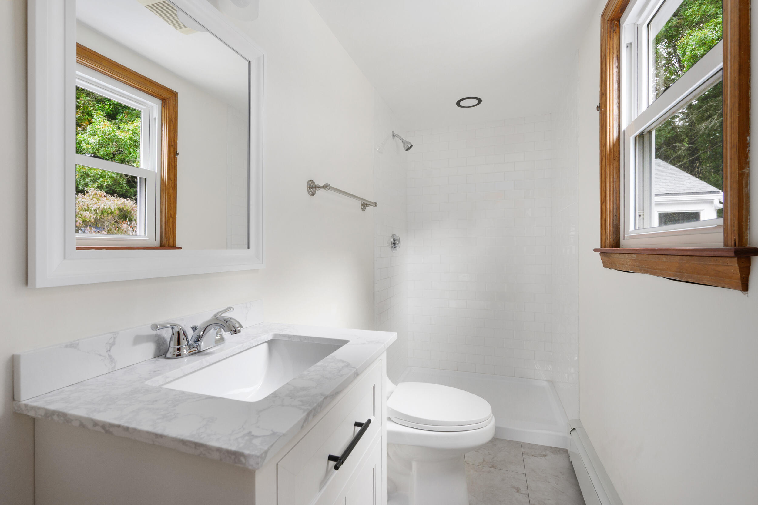 296 Buckskin Path Centerville, MA 02632 - Photo 16 of 34 a white toilet sitting next to a bathroom sink