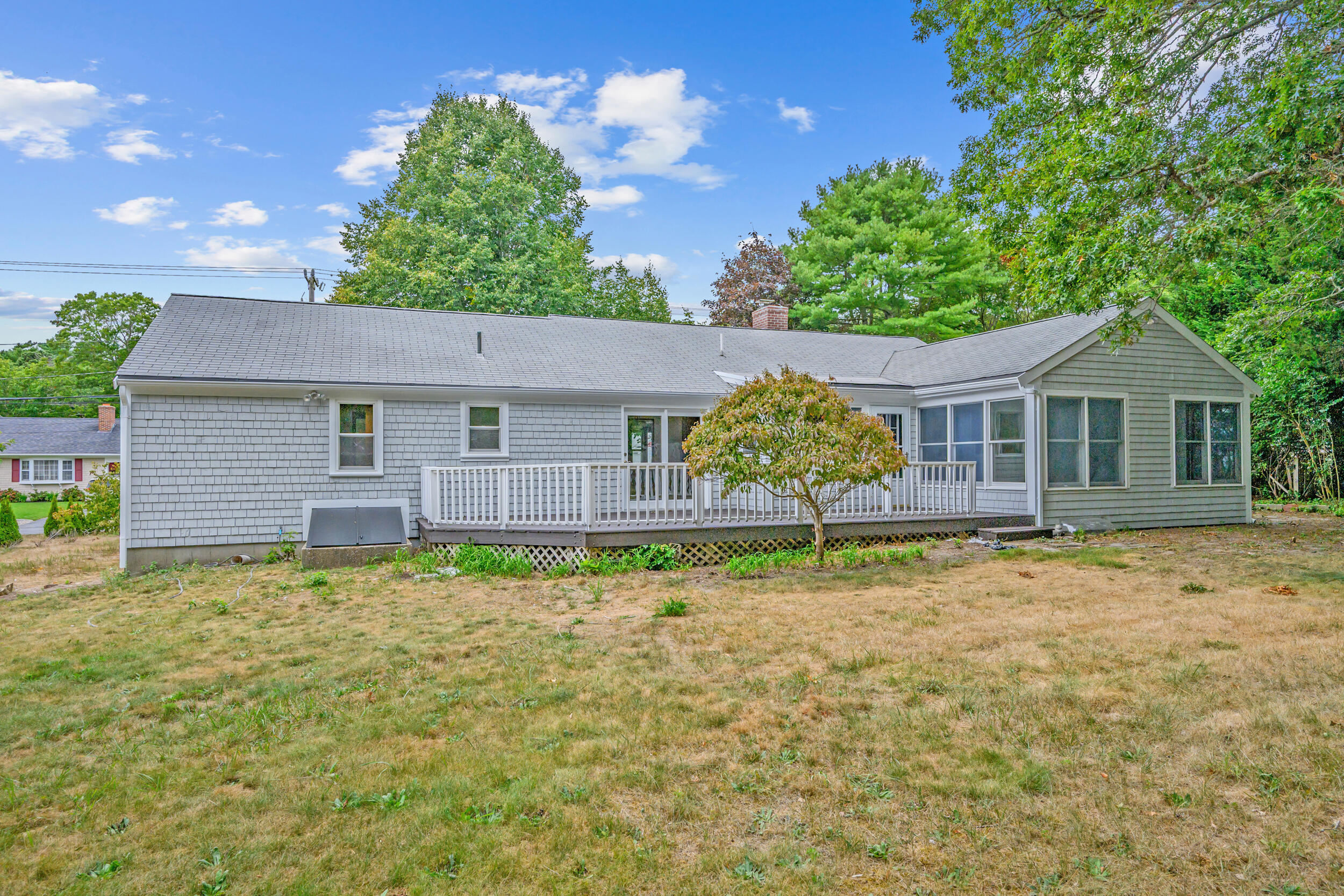 296 Buckskin Path Centerville, MA 02632 - Photo 21 of 34 a house that has a tree in front of it